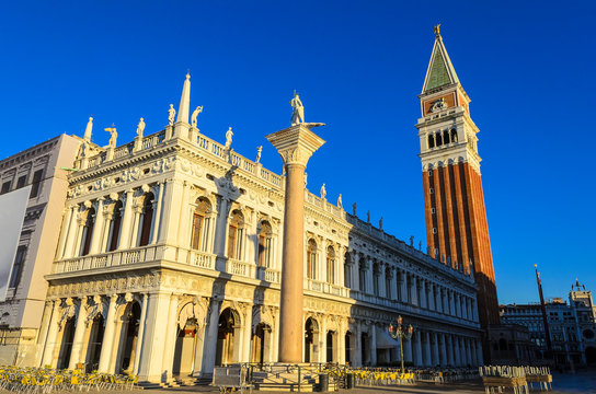 National Library Marciana (Biblioteca Nazionale Marciana) with St Mark's Campanile (Campanile di San Marco) on the background and Saint Mark and Saint Theodore Column in front. Venice. Italy