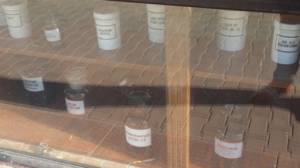 medical beakers and dummies in pharmacy shop