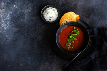 Gazpacho soup served in black bowl