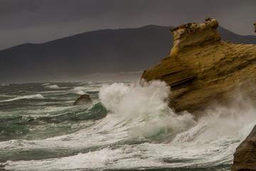 Giant waves as they crash into the headlands at Cape Kiwanda, north Oregon coast at Pacific City.
