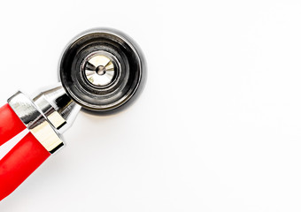 Close up view of red stethoscope isolated on white background. Medicine and health concept. Cardiology