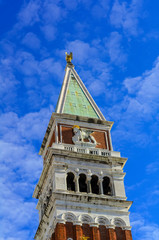 Spire of St Mark's Campanile (Campanile di San Marco) with a lion bas-relief