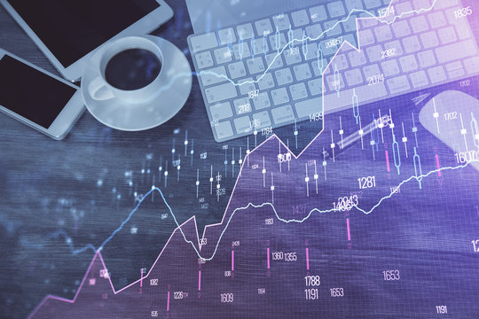 Double exposure of forex chart hologram over desktop with phone. Top view. Mobile trade platform concept.