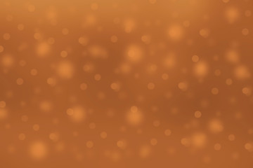 Bright orange blurred bokeh background of autumn foliage.