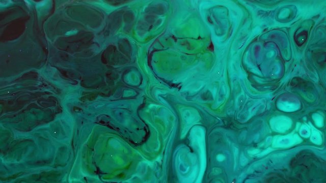 Abstract Colorful Paint Ink Explode Diffusion Psychedelic Blast Movement. soft colors, abstract composition. Acrylic texture with green marbling background 