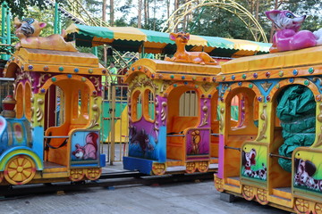 kids carousel in city fun park