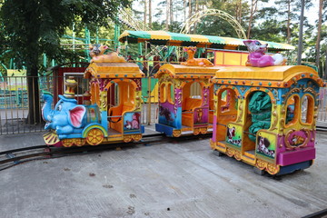 Obraz premium kids carousel in city fun park
