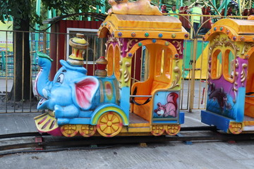 kids carousel in city fun park