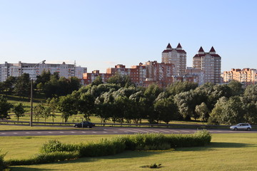 Fototapeta na wymiar Minsk suburb with residential buildings and green park