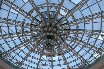 huge lustra hanging on malls ceiling