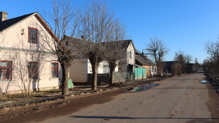 Fototapeta na wymiar belarusian rural village with huts and road