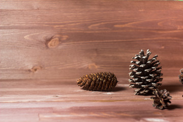 pine cones on wooden background. abstract composition. fir cones. Pine cones