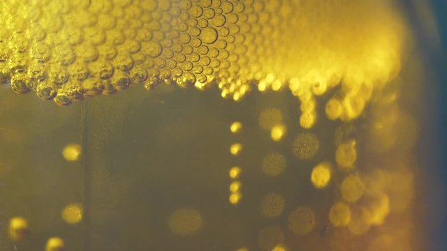 Fresh beer foam bubbled glass texture macro