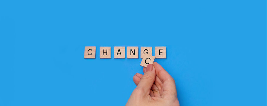 Change to chance  / Chance to change wooden letters on a light blue background