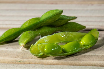 Edamame beans or green soybeans on the wooden table in Brazil