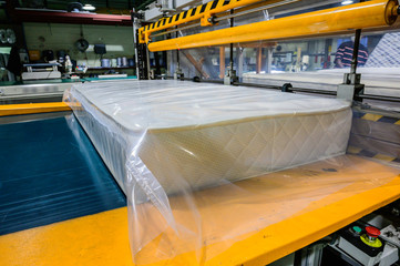 The machine for vacuum packing of orthopedic mattresses, vacuum packing of a mattress, production...