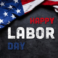 Fototapeta na wymiar US American flag on dark grunge background. For USA Labor day celebration. With Happy Labor Day text.