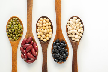 Collection of whole grains seeds isolated on white background. Healthy diet raw ingredients.