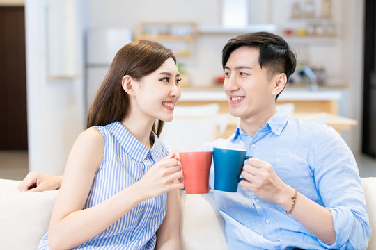 Young Couple Chatting At Home