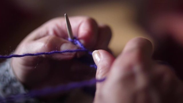 ederly woman hands Knitting doing crochet 