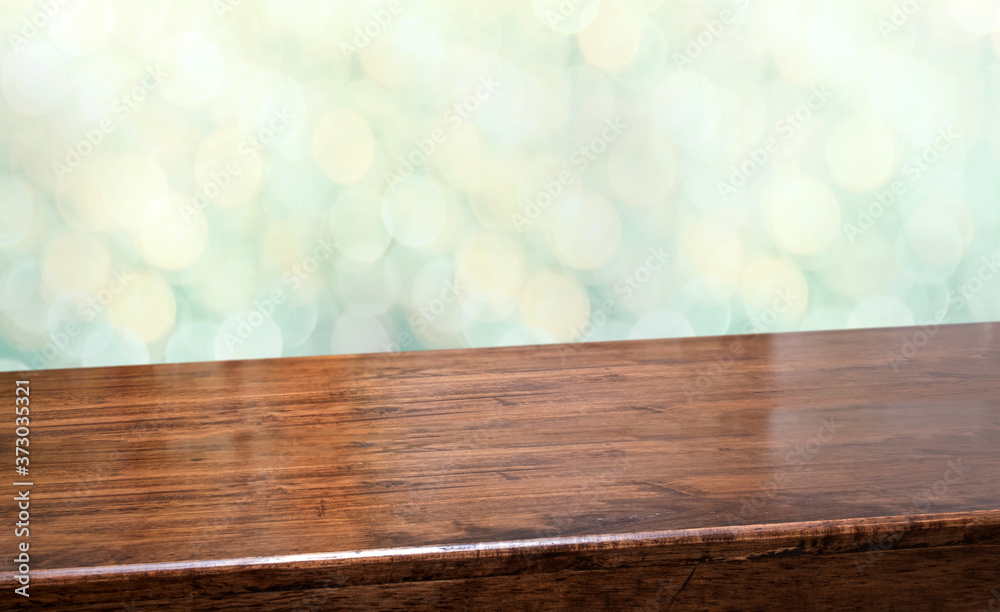 Aufkleber Perspective wood table with blur Christmas tree decorate string light and blue bokeh with snow light.Panoramic wooden countertop banner mock up for product display greeting card design online content