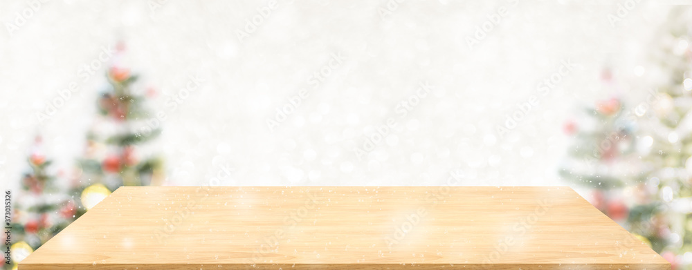 Aufkleber perspective wood table with blur christmas tree decorate string light and blue bokeh with snow light