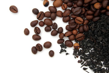 Coffee beans and loose leaf black tea on white background