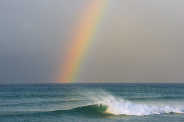 Rainbow over the sea before the storm