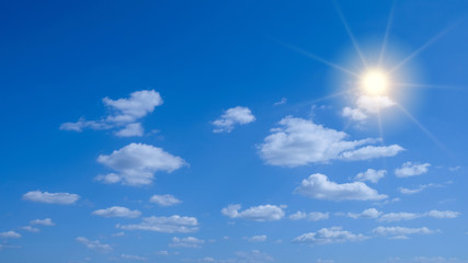 Naklejka na ściany i meble Sky cloud with sun. Beautiful bright blue sky with bright sun star flare background.
