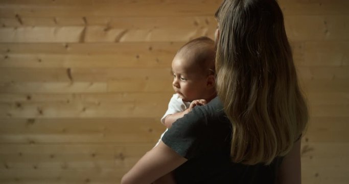 Young mother with her baby in loft space