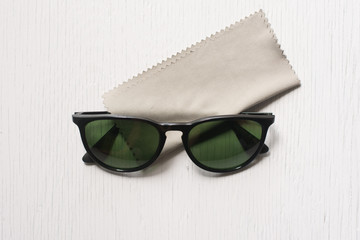 Close up cleaning glasses by microfiber cloth for cleaning lens and glasses concept.Close up...