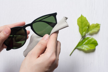 Close up cleaning glasses by microfiber cloth for cleaning lens and glasses concept.Close up...