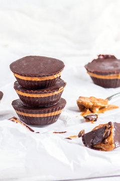 Chocolate peanut butter cups on light background