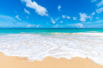 Serenity white snad sea wave beach against blue sky with cloud