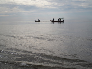 Fototapeta na wymiar Thai fishing boat in the dark sea