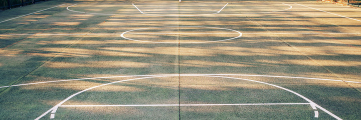 white mark lines on public sport playground with daylight shadows