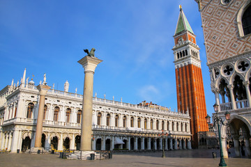 View of Piazzetta San Marco with St Mark's Campanile, Lion of Venice statue, Biblioteca and Palazzo Ducale in Venice, Italy