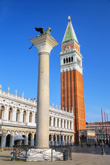 Fototapeta na wymiar View of Piazzetta San Marco with St Mark's Campanile, Lion of Venice statue and Biblioteca in Venice, Italy