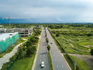Aerial of Daang Hari Road in Imus, Cavite, Philippines. Empty avenue with almost zero traffic. On...