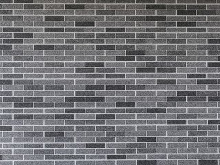 Fototapeta na wymiar decorative brick of different shades of gray - wall background