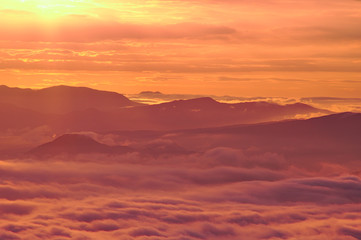 scenic view of mountain range and clouds at dawn.landscape of sea of clouds.from tsubetsu-pass,hokkaido ,japan.