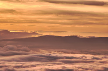 scenic view of mountain range and clouds at dawn.landscape of sea of clouds.from tsubetsu-pass,hokkaido ,japan.
