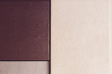 Fototapeta premium Old cover books backdrop, top view. retro book hardcovers in beige, gray and blue brown. Flat lay compisition