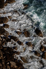 Ocean wave background breaking sea water rocky shore