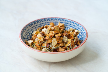 Refreshing Dry Tea Satsuma, Pineapple and Apple in Bowl served for Cold Tea in Summer.