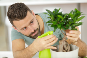 a man is gardening indoors