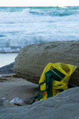A old plastic bag with clothers abandoned at the coast of a wild beach close to Obzor, Bulgaria.