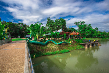 Phuttha Utthayan Wat Pa Dong Rai-Udon Thani:June 19,2020, the atmosphere inside a religious tourist site(Santi Wanaram Temple),a large lotus flower in the middle of the pool and a history in thailand.