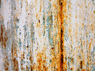 Creative bright metallic background. Flat background texture of dirty rusty metal. Bright rusty spots as the main background for a vintage scratched design