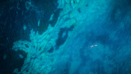 Kayak on Sydney beach with clear sea bed underwater 